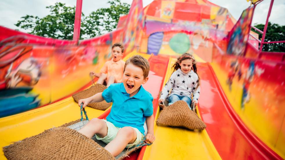 Kids going down slide